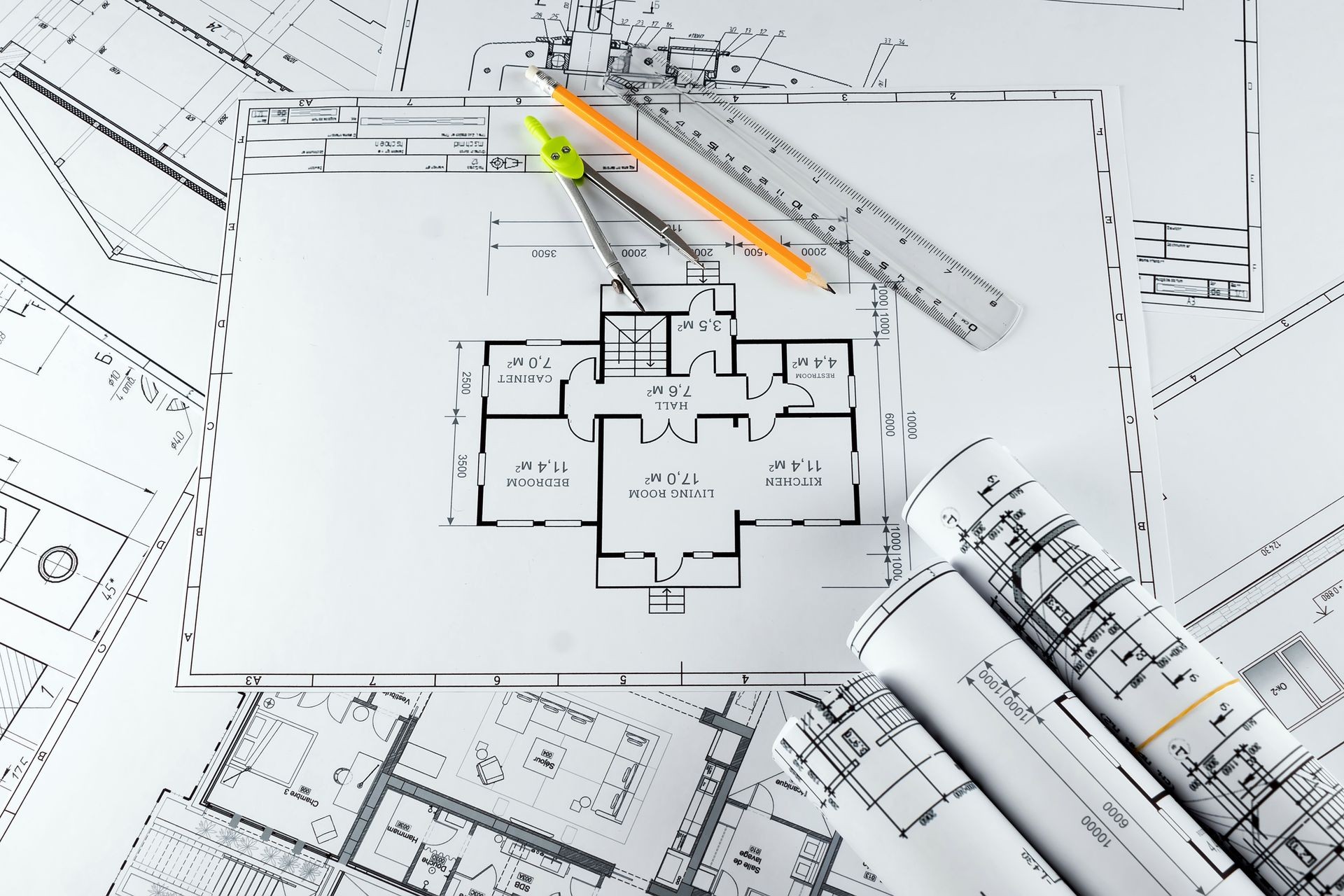 Architectural construction drawings twisted into a roll, construction projects on paper. The concept of architecture, construction, engineering. Copy space. Architectural construction drawings twisted into a roll, construction projects on paper. The concept of architecture, construction, engineering. Copy space.